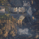 Image for article titled New aerial photos show Kilauea’s lava devouring neighborhoods
